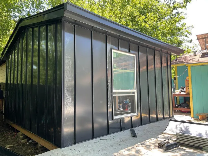 Black standing seam metal wall panels for Roof Inspection in Elk Grove Village