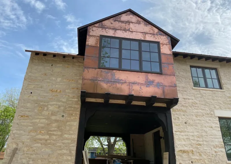 Copper metal panel facade on a stone building for Skylight Installation in Elk Grove Village